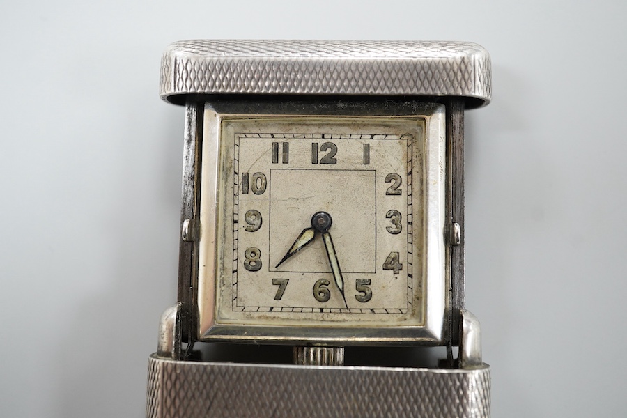 An early to mid 20th century engine turned 935 standard white metal combination travelling watch/pencil holder and notepad section, with Arabic dial, 42mm.